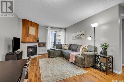 105G 1121 Mckercher Drive, Saskatoon, SK - Indoor Photo Showing Living Room With Fireplace