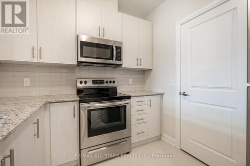 310 - 5917 Main Street, Whitchurch-Stouffville, ON - Indoor Photo Showing Kitchen With Upgraded Kitchen
