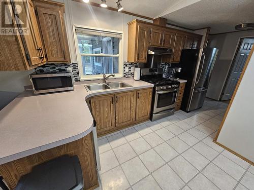 13595 Swallow Road, Prince George, BC - Indoor Photo Showing Kitchen With Double Sink