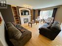 3936 E Nottingham Crescent, Regina, SK  - Indoor Photo Showing Living Room With Fireplace 