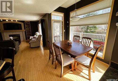 3936 E Nottingham Crescent, Regina, SK - Indoor Photo Showing Dining Room With Fireplace