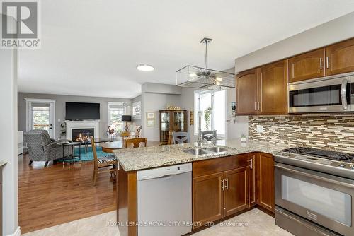 300 Ridge Top Crescent, Guelph/Eramosa, ON - Indoor Photo Showing Kitchen With Fireplace With Double Sink