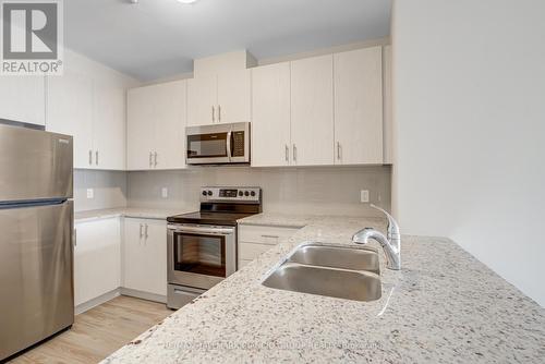 703 - 5917 Main Street, Whitchurch-Stouffville, ON - Indoor Photo Showing Kitchen With Double Sink