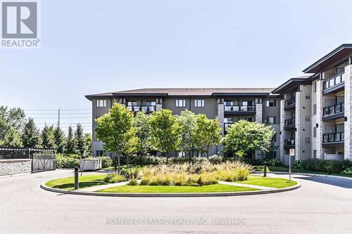 203 - 570 Lolita Gardens, Mississauga, ON - Outdoor With Balcony With Facade