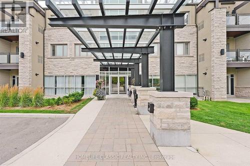 203 - 570 Lolita Gardens, Mississauga, ON - Outdoor With Balcony With Facade