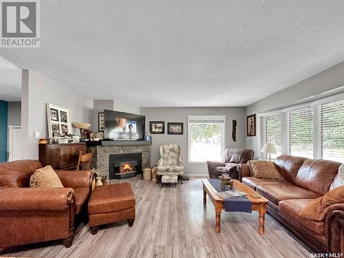 1000 Carlton Drive, Esterhazy, SK - Indoor Photo Showing Living Room With Fireplace