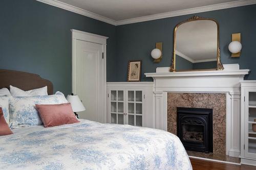 153 St. Clair Avenue, Hamilton, ON - Indoor Photo Showing Bedroom With Fireplace