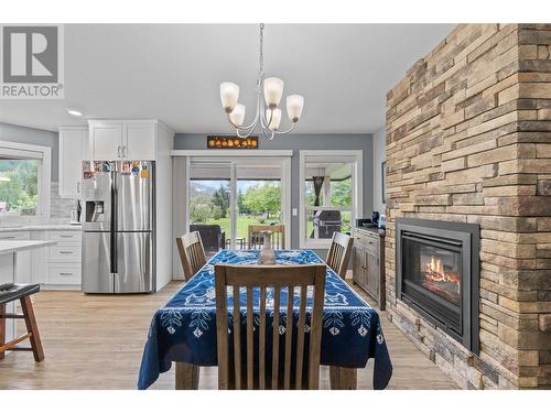 2170 Cambie Solsqua Road, Sicamous, BC - Indoor Photo Showing Dining Room With Fireplace