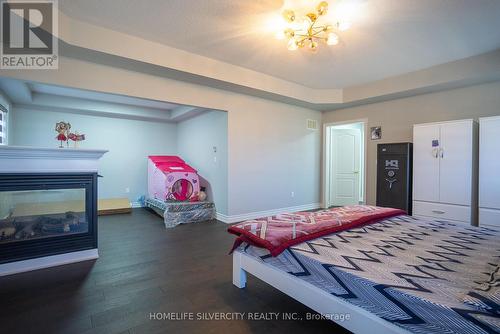 73 Pathway Drive, Brampton, ON - Indoor Photo Showing Bedroom With Fireplace