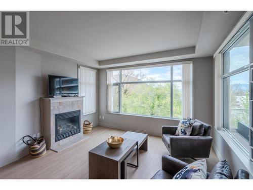 100 Lakeshore Drive Unit# 415, Penticton, BC - Indoor Photo Showing Living Room With Fireplace