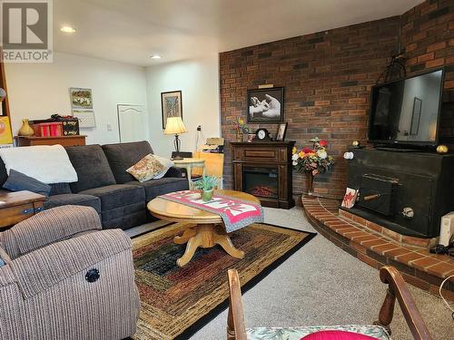 6595 Herry Road, Vernon, BC - Indoor Photo Showing Living Room With Fireplace