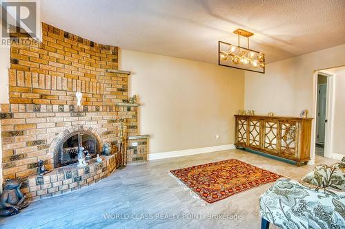 22 Madelaine Crescent, Brampton, ON - Indoor Photo Showing Living Room With Fireplace
