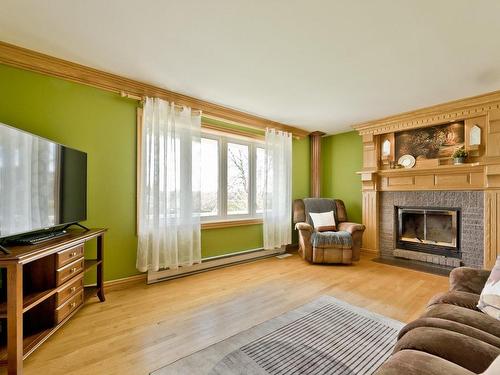 Salon - 621 Rue Des Muguets, Coaticook, QC - Indoor Photo Showing Living Room With Fireplace