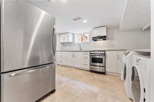 kitchen & updated appliances, with your own in-suite laundry. - 65 East 11Th Street|Unit #Lower Level, Hamilton, ON - Indoor