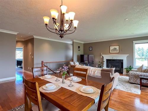 3431 Mary Anne Cres, Colwood, BC - Indoor Photo Showing Dining Room With Fireplace