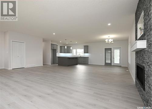 9 2330 Morsky Drive, Estevan, SK - Indoor Photo Showing Living Room With Fireplace