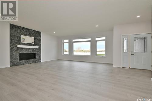 9 2330 Morsky Drive, Estevan, SK - Indoor Photo Showing Living Room With Fireplace