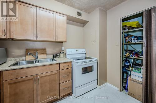 1610 - 975 Warwick Court, Burlington, ON - Indoor Photo Showing Kitchen With Double Sink