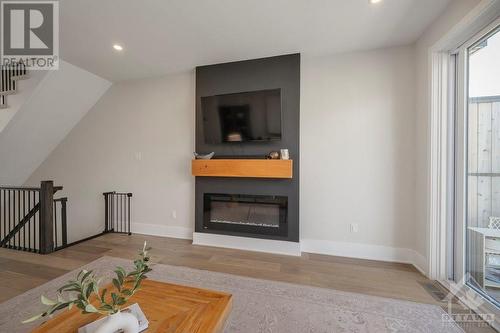813 Mikinak Road, Ottawa, ON - Indoor Photo Showing Living Room With Fireplace
