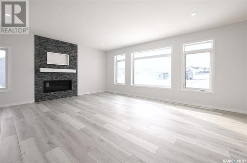 7 2330 Morsky Drive, Estevan, SK - Indoor Photo Showing Living Room With Fireplace