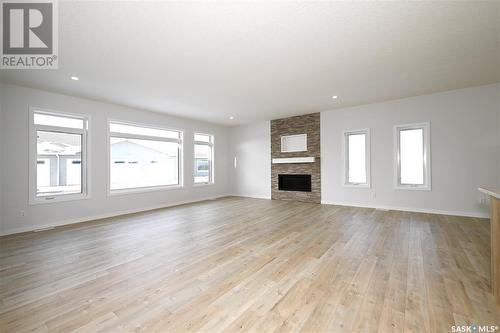 8 2330 Morsky Drive, Estevan, SK - Indoor Photo Showing Living Room With Fireplace