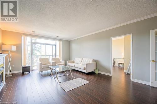 255 Keats Way Unit# 507, Waterloo, ON - Indoor Photo Showing Living Room With Fireplace