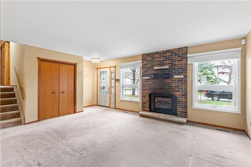 31 Wendon Bay, Winnipeg, MB - Indoor Photo Showing Living Room With Fireplace