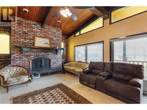 2545 6 Highway E, Lumby, BC - Indoor Photo Showing Living Room With Fireplace