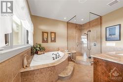 Large En-Suite Bathroom with Soaker Tub with Jets, and Glass Shower - 