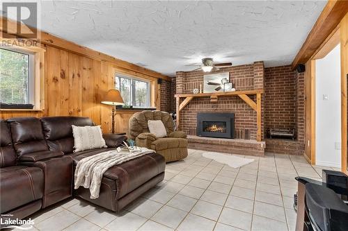 98 Clearwater Lake Road, Port Sydney, ON - Indoor Photo Showing Living Room With Fireplace