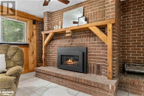 98 Clearwater Lake Road, Port Sydney, ON - Indoor Photo Showing Living Room With Fireplace