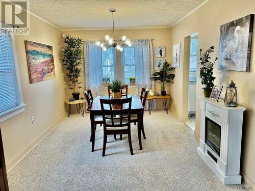 6 Drury St, Kapuskasing, ON - Indoor Photo Showing Dining Room With Fireplace
