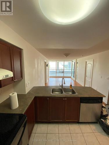 409 - 60 Brian Harrison Way, Toronto, ON - Indoor Photo Showing Kitchen With Double Sink