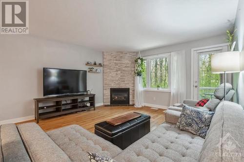 99 Steele Park Private, Ottawa, ON - Indoor Photo Showing Living Room With Fireplace