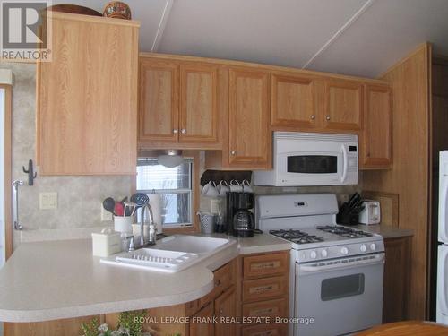 56 - 2152 Nestle In Resort Park, Kawartha Lakes, ON - Indoor Photo Showing Kitchen With Double Sink