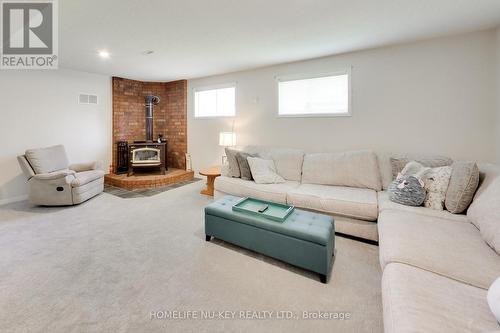 4 Green Pine Avenue, Springwater, ON - Indoor Photo Showing Living Room With Fireplace