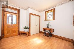 Larger foyer. Beautiful wood trim. So much character including original hardware on most doors. - 