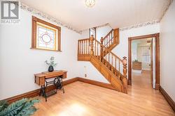 Livingroom on RT. Kitchen through doorway. Stairs to 3 bedrooms, office, main bath and loft. - 