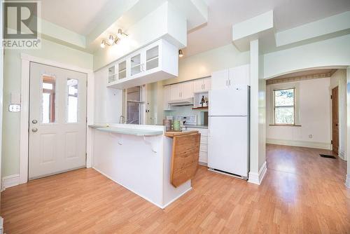 Kitchen entrance from rear porch or garage. Formal dining room, and bathroom door ahead. - 1094 Madawaska Street, Calabogie, ON - Indoor Photo Showing Kitchen