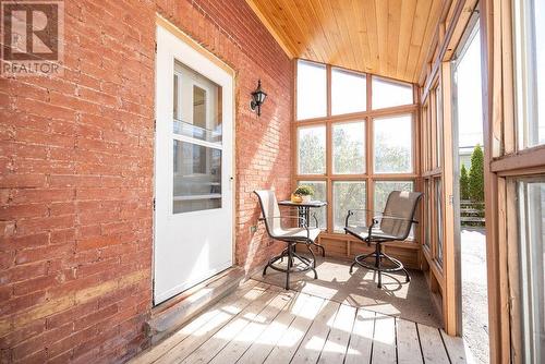 Kitchen entry from rear enclosed porch. - 1094 Madawaska Street, Calabogie, ON -  With Deck Patio Veranda With Exterior