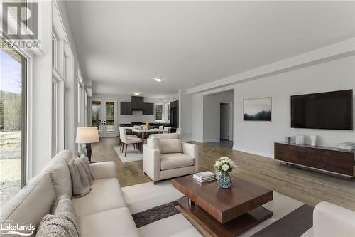 This image is virtually staged. - 1037 Greensview Drive Unit# 56, Lake Of Bays, ON - Indoor Photo Showing Living Room