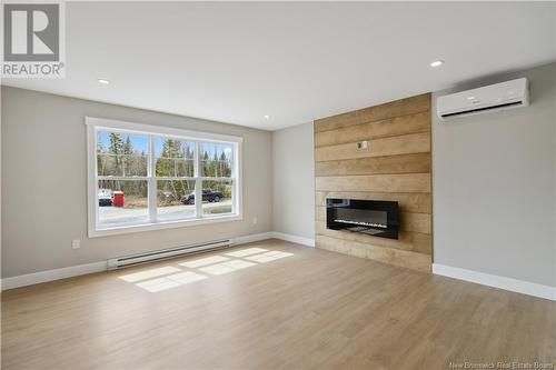 9 Waylon Court, Rusagonis, NB - Indoor Photo Showing Living Room With Fireplace