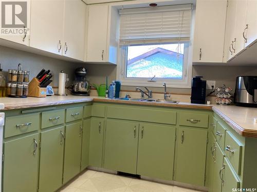 17 Mccormick Crescent, Regina, SK - Indoor Photo Showing Kitchen With Double Sink