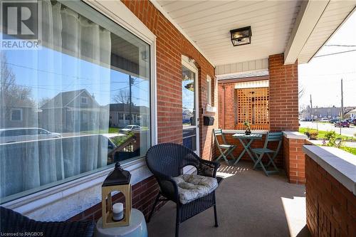 Enjoy your morning coffee or a great book on your covered front porch! - 15 Newlands Avenue, Hamilton, ON - Outdoor With Exterior