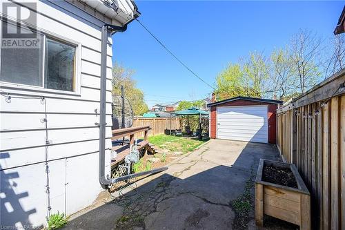 Spacious, full fenced yard with detached garage. - 15 Newlands Avenue, Hamilton, ON - Outdoor With Exterior
