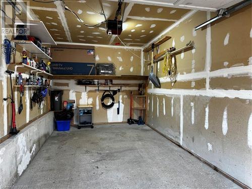 Large garage with inside and outside parking - 365 Pioneer Drive Unit# 22, Kitchener, ON - Indoor Photo Showing Garage