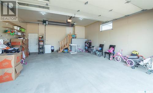 405 Clubhouse Boulevard W, Warman, SK - Indoor Photo Showing Garage