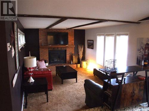 201 Main Street, Leader, SK - Indoor Photo Showing Living Room With Fireplace