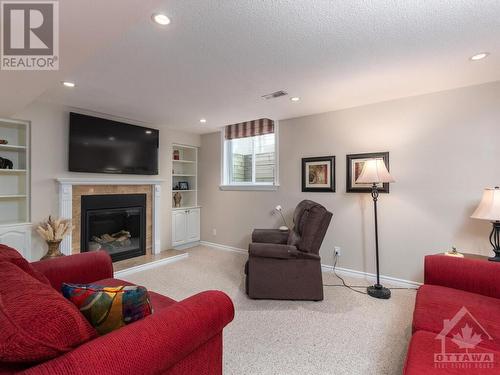 Lovely gas fireplace. - 9 Kinalea Crescent, Stittsville, ON - Indoor Photo Showing Living Room With Fireplace