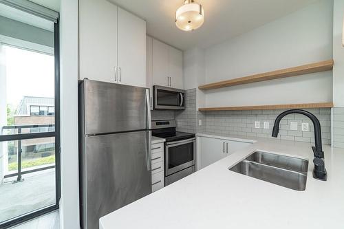 101 Locke Street S|Unit #205, Hamilton, ON - Indoor Photo Showing Kitchen With Double Sink With Upgraded Kitchen